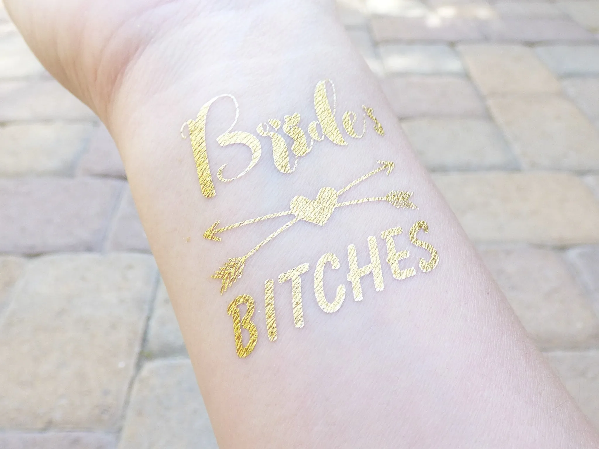 Bride Tattoo With Arrows and Hearts