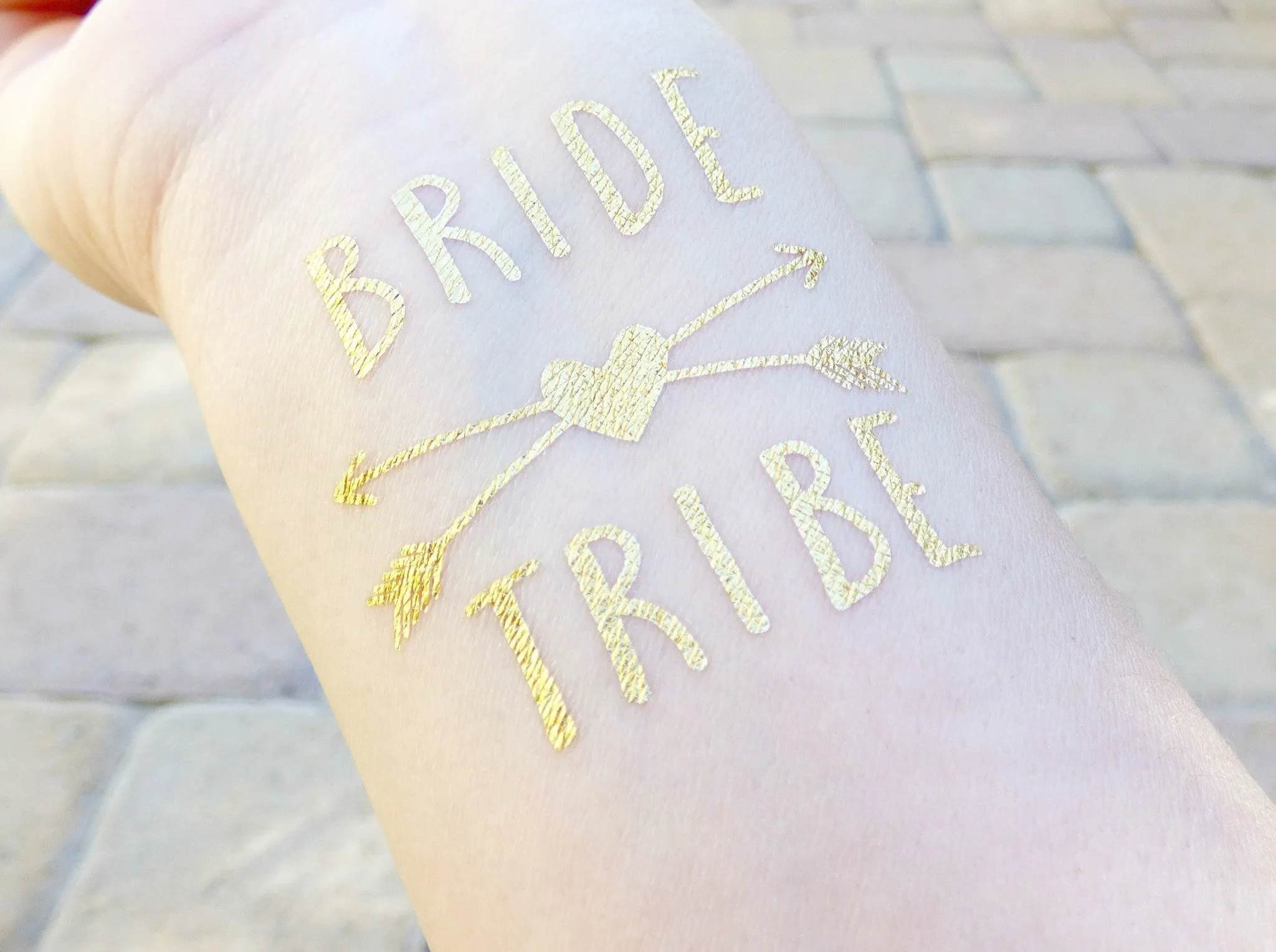 Bride Tattoo With Arrows and Hearts