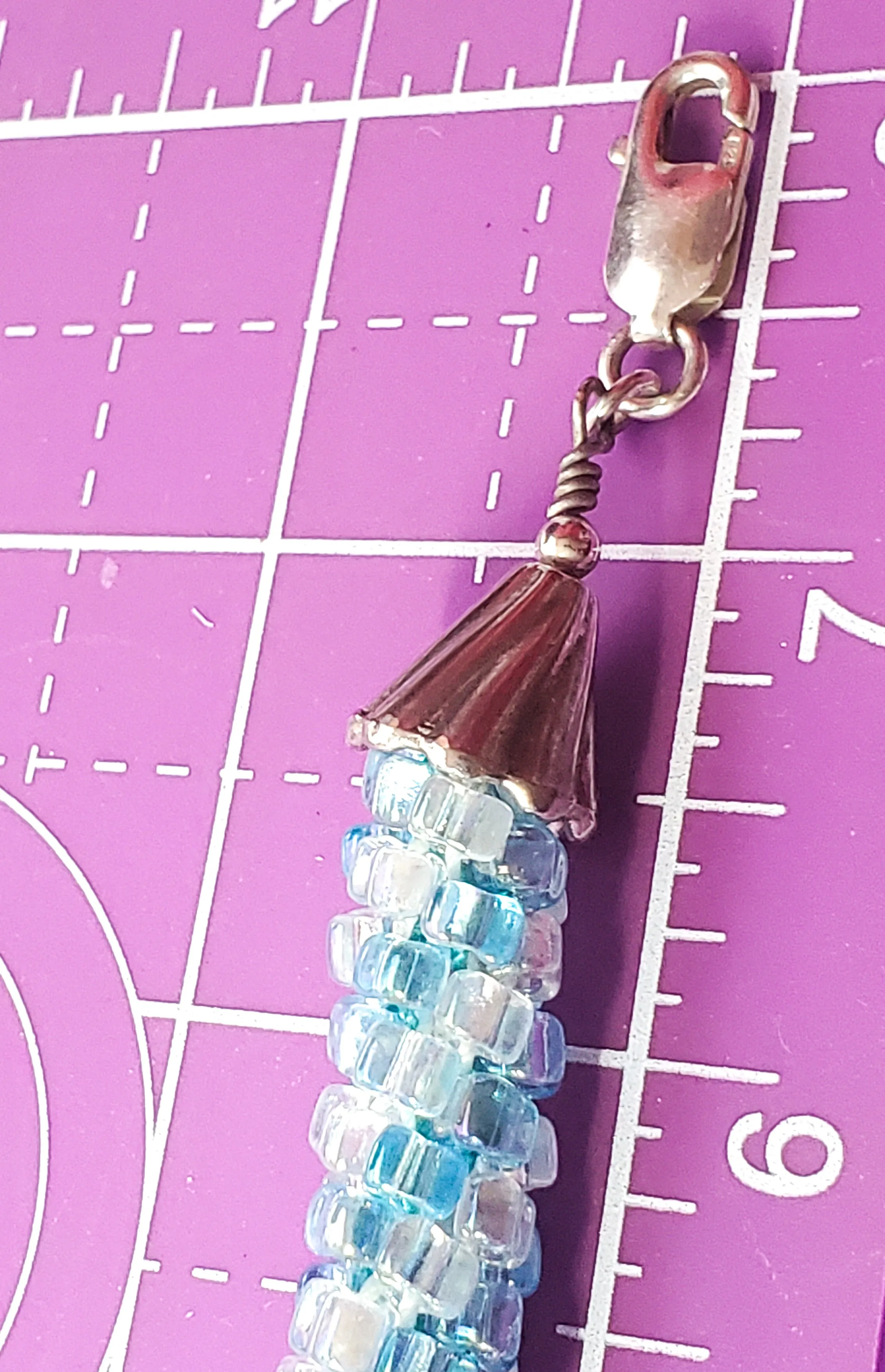 Oceans baby blue and clear torsade beaded bracelet with sterling silver clasp