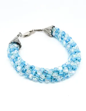 Oceans baby blue and clear torsade beaded bracelet with sterling silver clasp