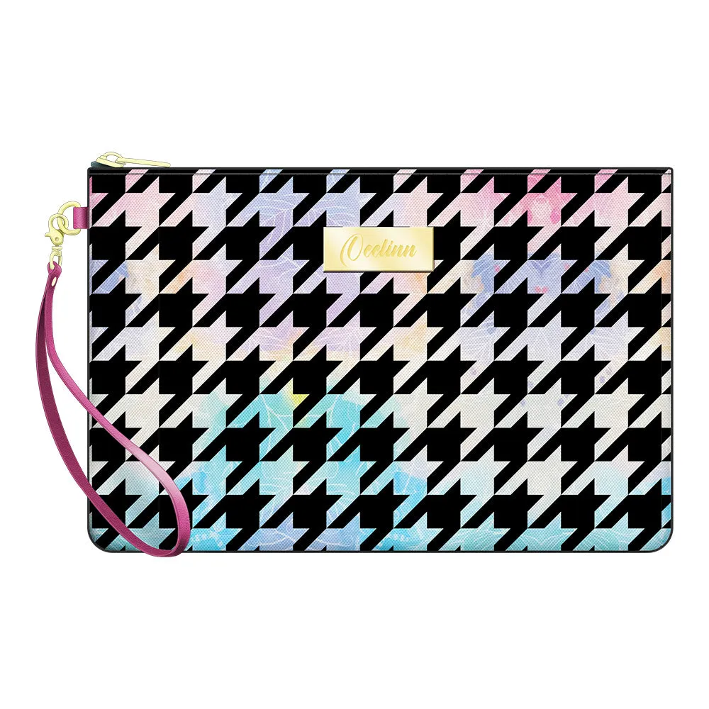 Stylish And Versatile Zip Pouch Wristlet Features A Houndstooth Design